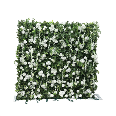 Square floral wall densely covered with white flowers and green leaves.