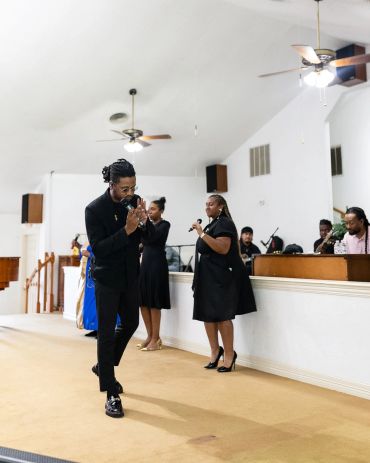 People engaged in worship inside a church.