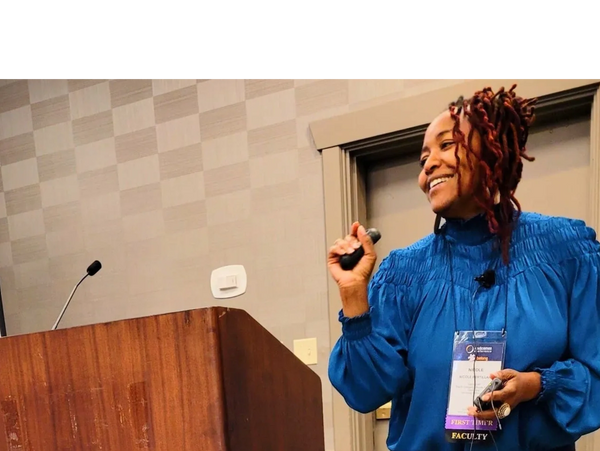 Nicole speaking at a conference