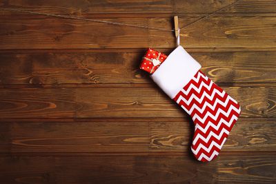 zig-zag design stocking with gift, hung on string with a clothes pin