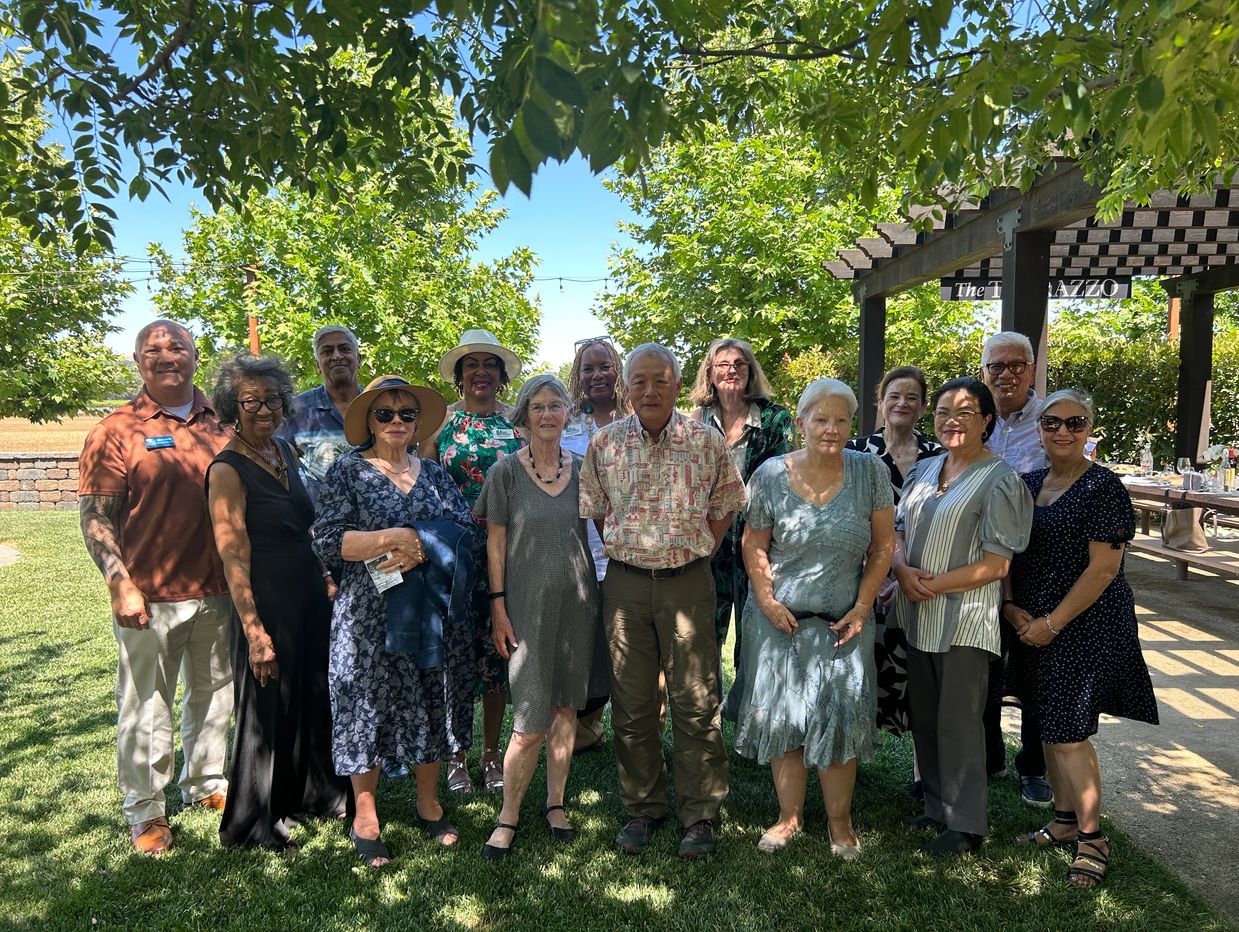group of old people taking group photo