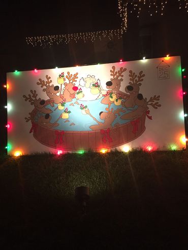 Santa and the reindeer relaxing after a long night on Christmas Card Lane. Christmas lights in San D