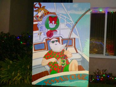 Santa and Rudolph deep sea fishing on Christmas Card Lane. Christmas lights in San Diego. 
