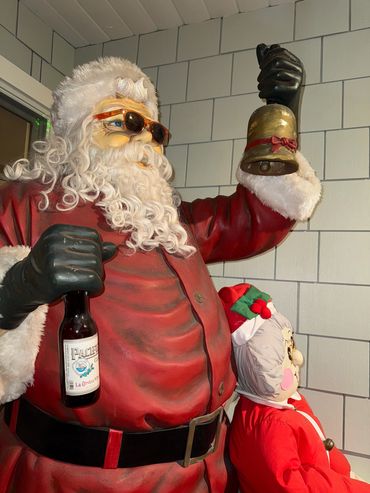 Santa with shades and a bell on Christmas Card Lane. Christmas lights in San Diego. 