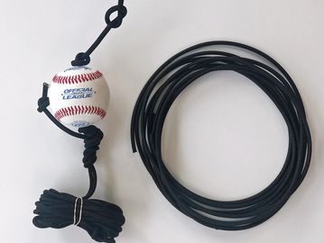 Baseball tied with black cords and a coiled black rope on a white background.