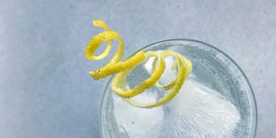 Twisting is the garnishing the drinks.