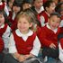 group of children sitting down and laughing