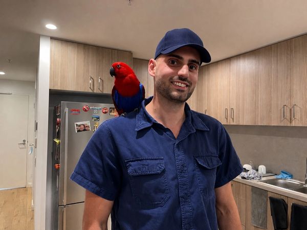 Me at a customers house taking a photo with his parrot