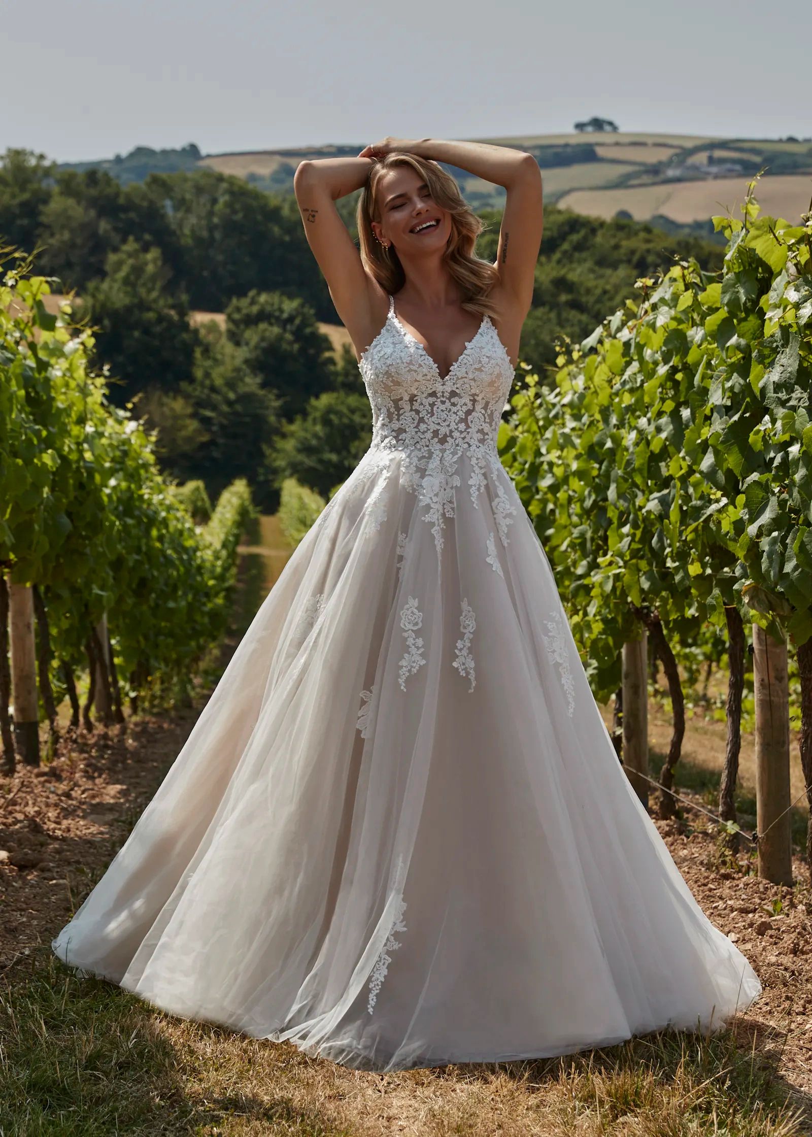 JW220925
Wonderful lace covered A-line dress with a V-neckline and beaded spagetti straps. Shown in 