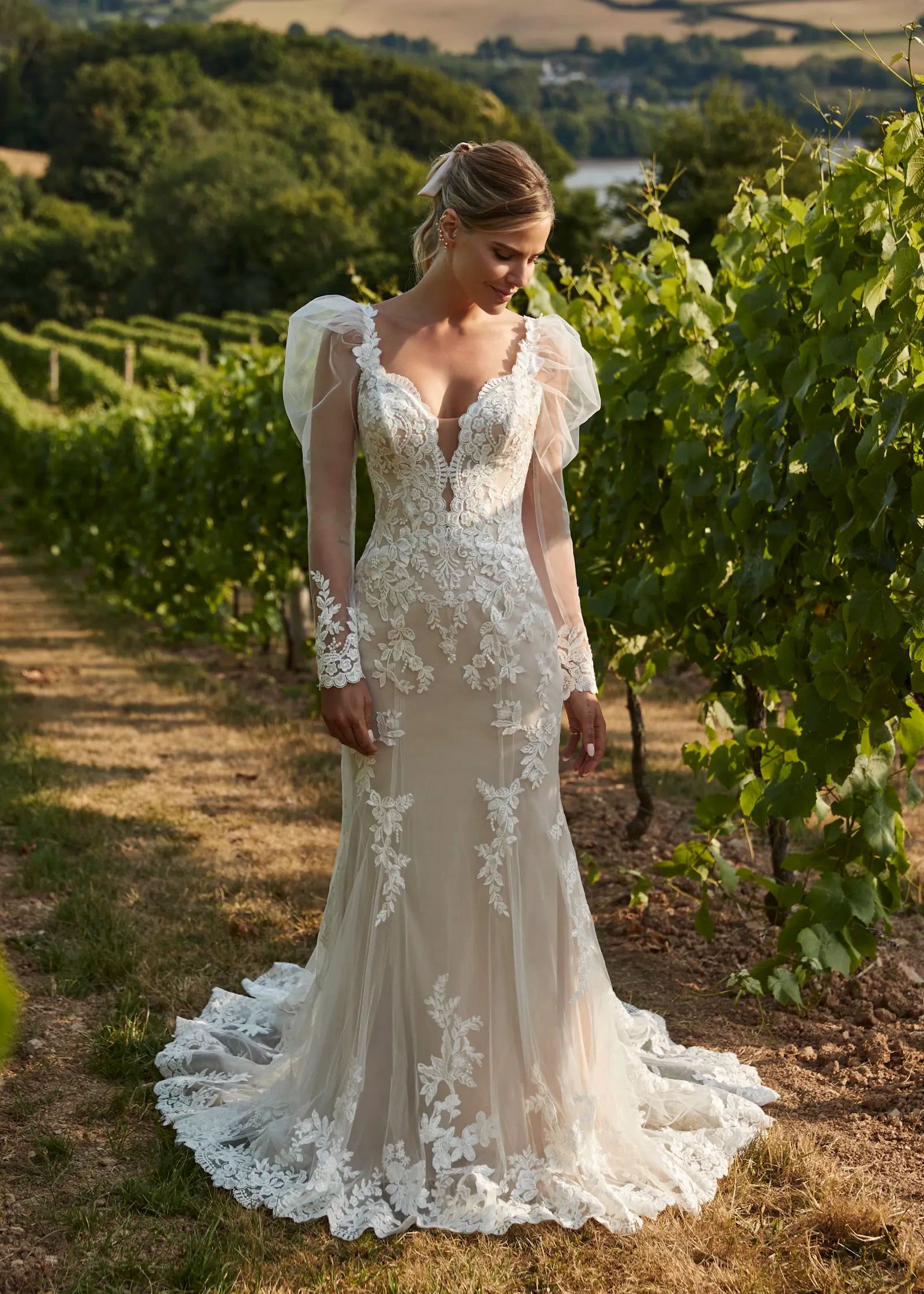 JW220930
A jaw dropping lace fit and flare dress with a plunging neckline and illusion sleeves. Show