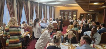 People dining in a formal restaurant setting.