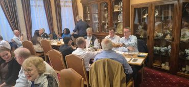 Group of people dining in a cozy restaurant.