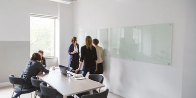 project planning on whiteboard in boardroom