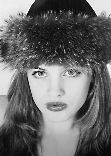 Model wears Fur hat for a black and white photo-session eyes & lips in full makeup