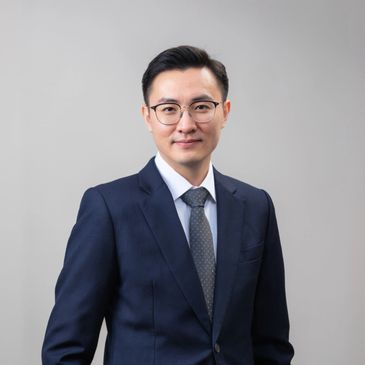 Professional man in suit with glasses.
