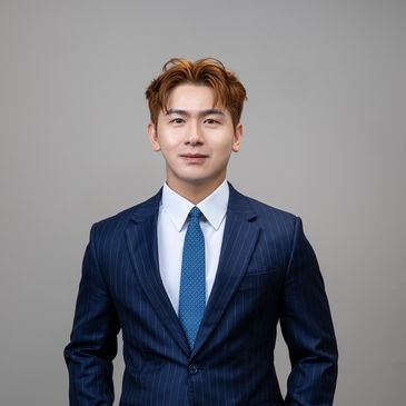 Young man in a blue suit and tie.