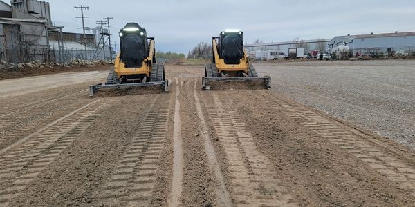 skid steer work, grading a gravel driveway in Moore, Oklahoma
