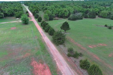 before picture of a fence line clearing in Luther, Oklahoma.