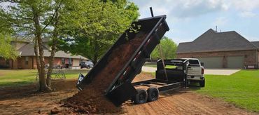 Moving dirt in a job site for a pad in Moore, Oklahoma.