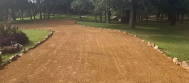 Granite driveway pushed and smoothed out in Norman, Oklahoma.