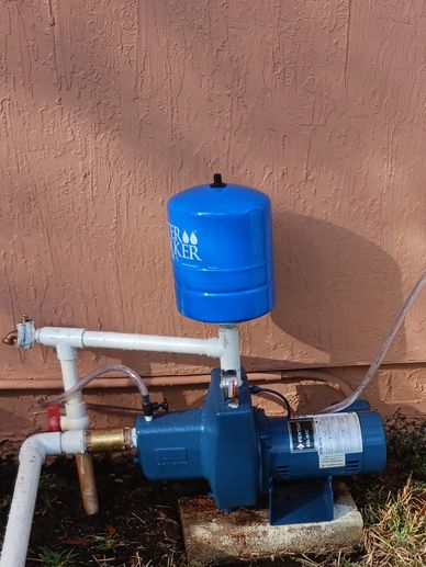 Well Pump, Tank and Rust Remover in Yard