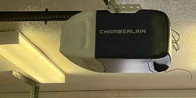 Chamberlain garage door opener installed on the ceiling.