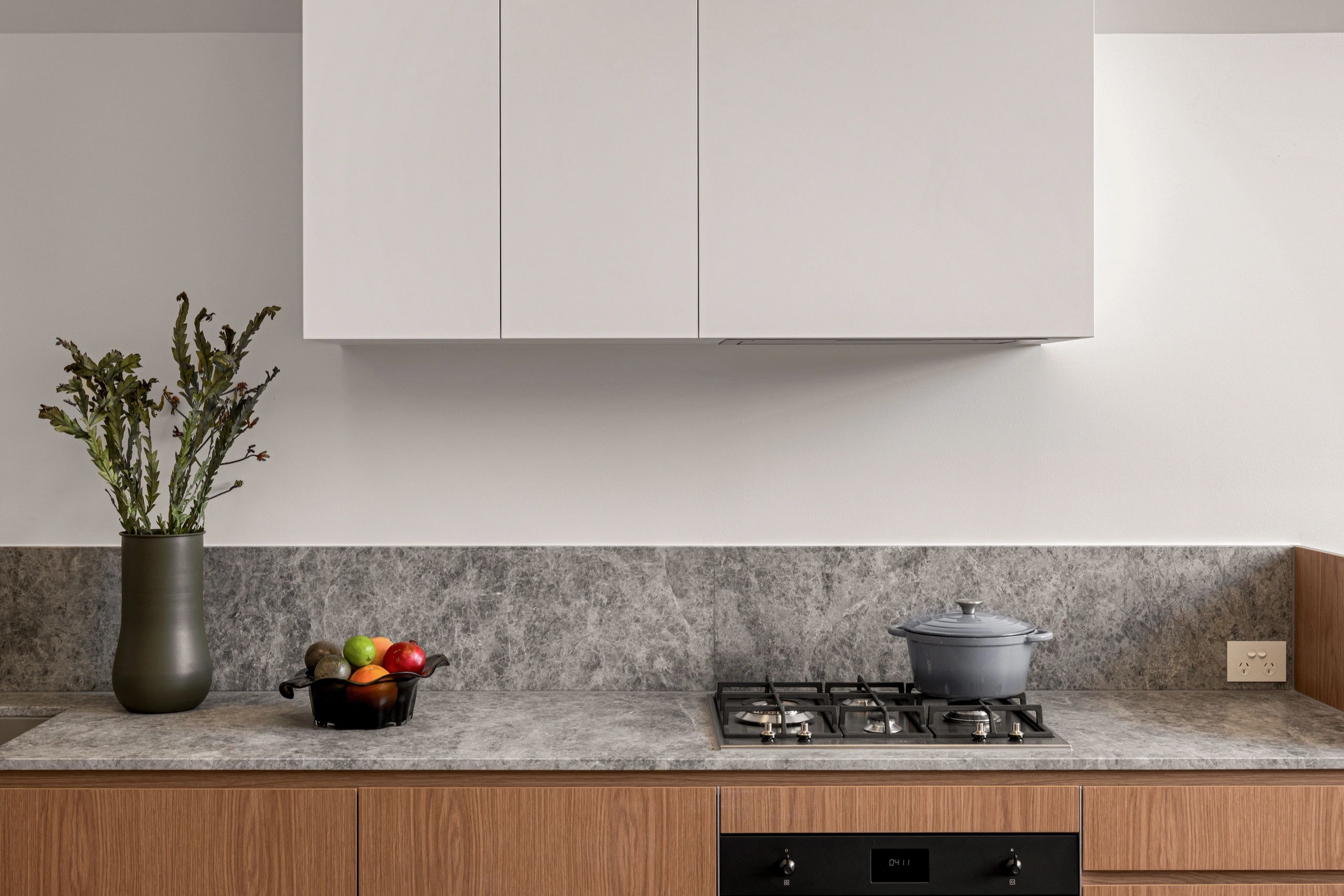 Minimalist kitchen countertop with stove and decor