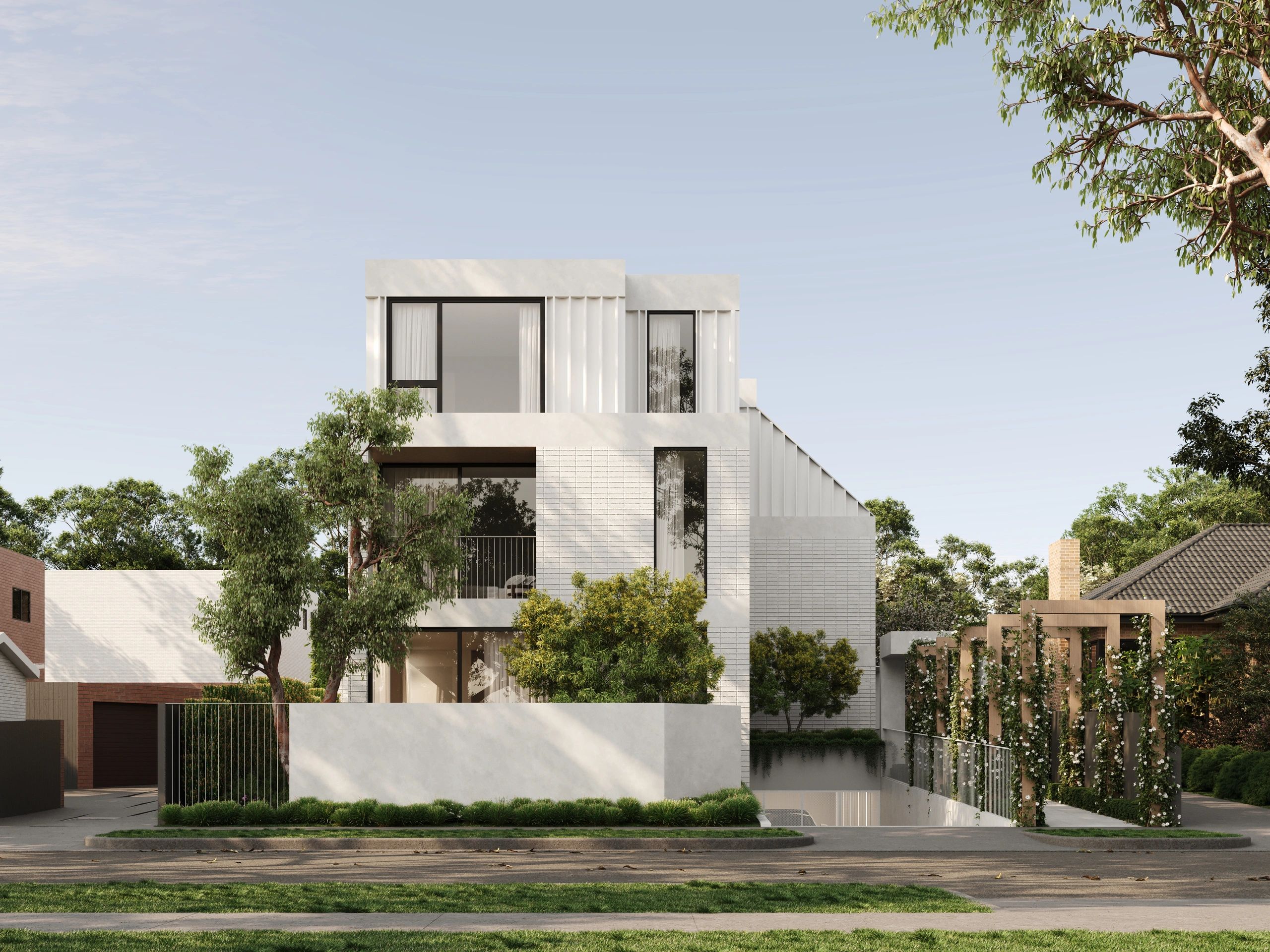 Modern white minimalist house with large windows and greenery.