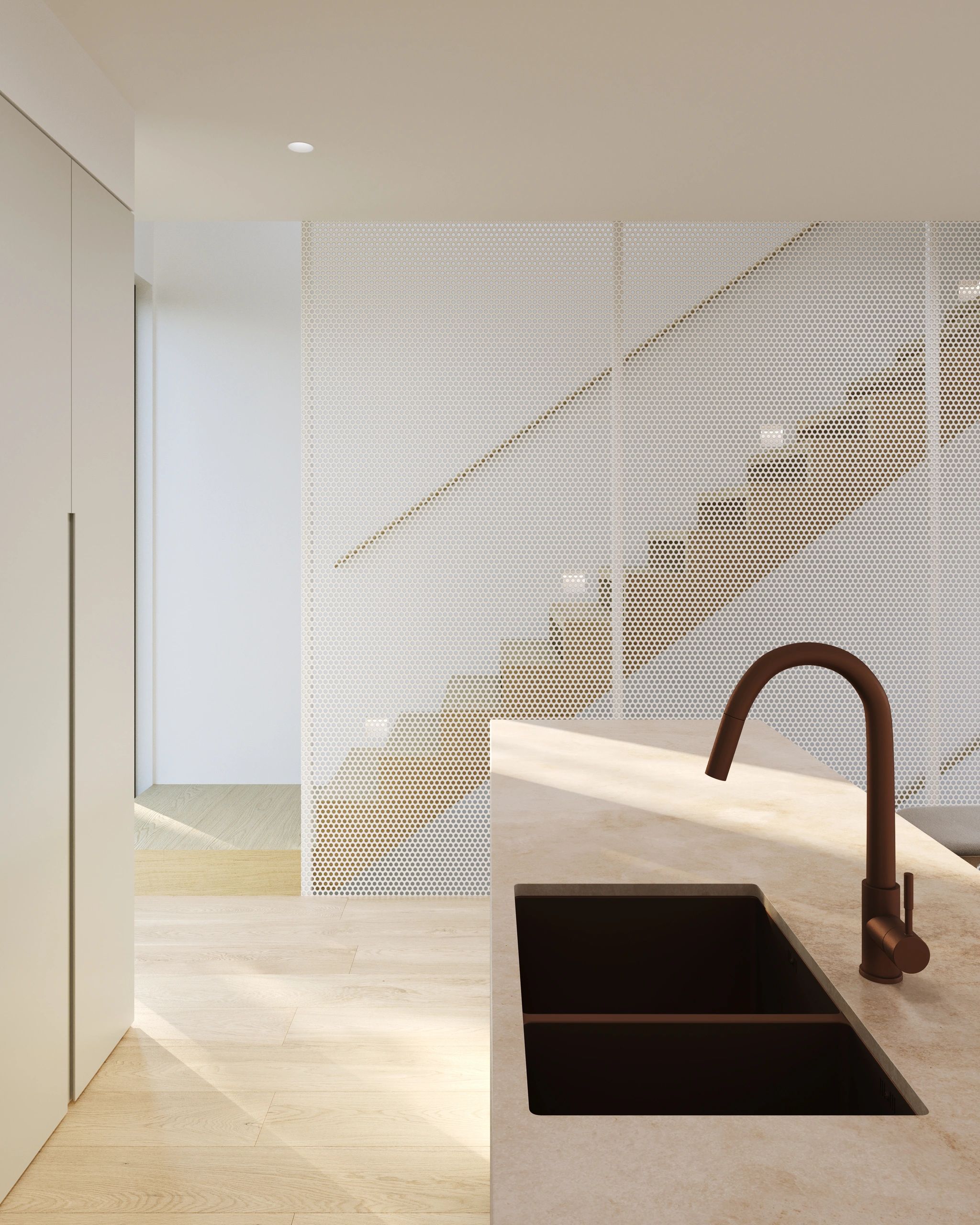 Modern kitchen with beige countertops and perforated stair railing.