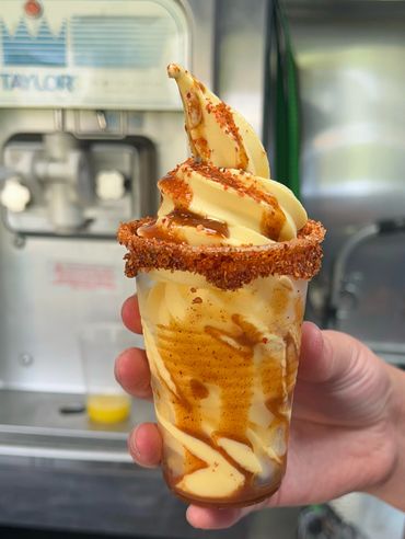 A woman holding ice cream in her hand