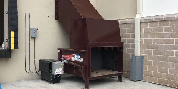 Stationary Compactor and Custom Chute Installation