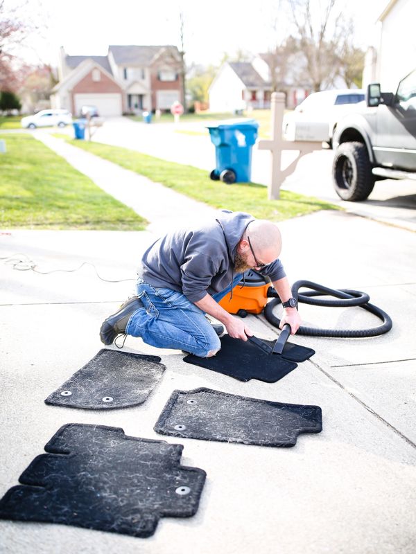 Carl washing and detailing mats by using a steamer, extractor, vacuum, and agitator. 