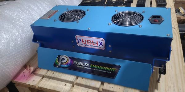 Blue industrial machine with cooling fans and Publix branding on a wooden pallet.