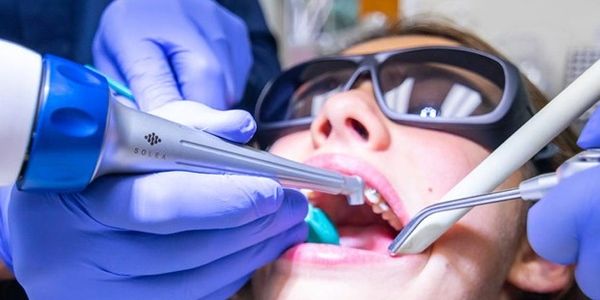 teen undergoing laser dental procedure in Staten Island dental office