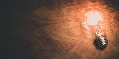 Free image of lightbulb on wood from Pixabay