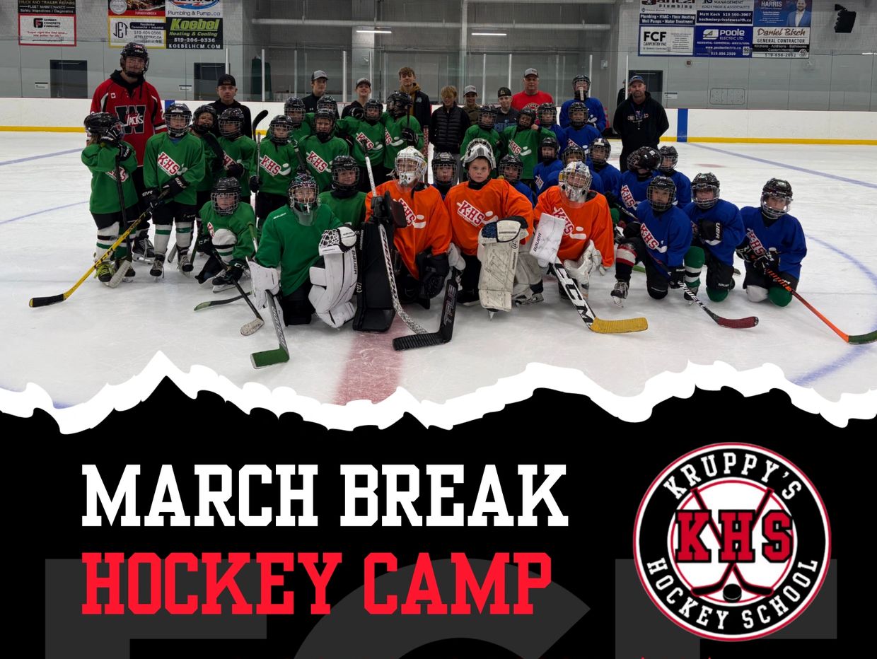 Youth hockey players pose on ice during March Break Hockey Camp.