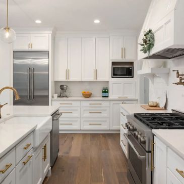 Modern kitchen remodel in Tampa with white cabinets, new countertops & stainless steel appliances