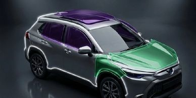 A silver SUV with a purple roof and green hood on a dark background.