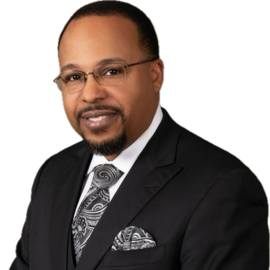 Professional man in a suit with patterned tie and pocket square.