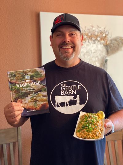 Vegan Chef Jay Weiner holding The Veganaise Cookbook and recipe from it