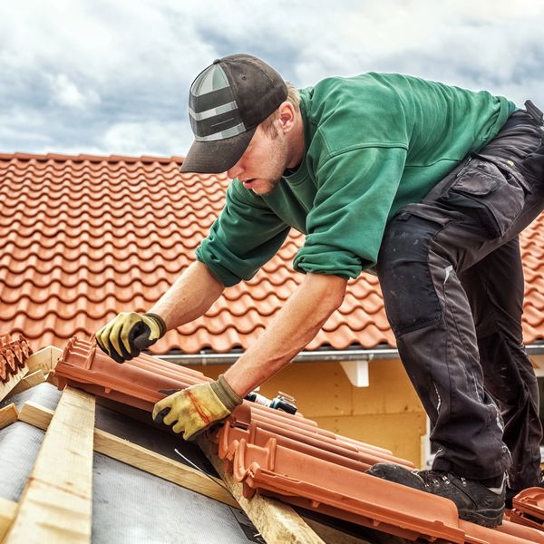 A professional installing a new roof