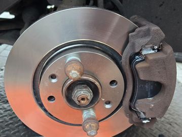 Close-up of a car brake disc and caliper.