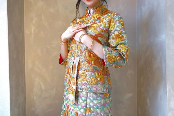 Woman in a traditional colorful embroidered dress.
