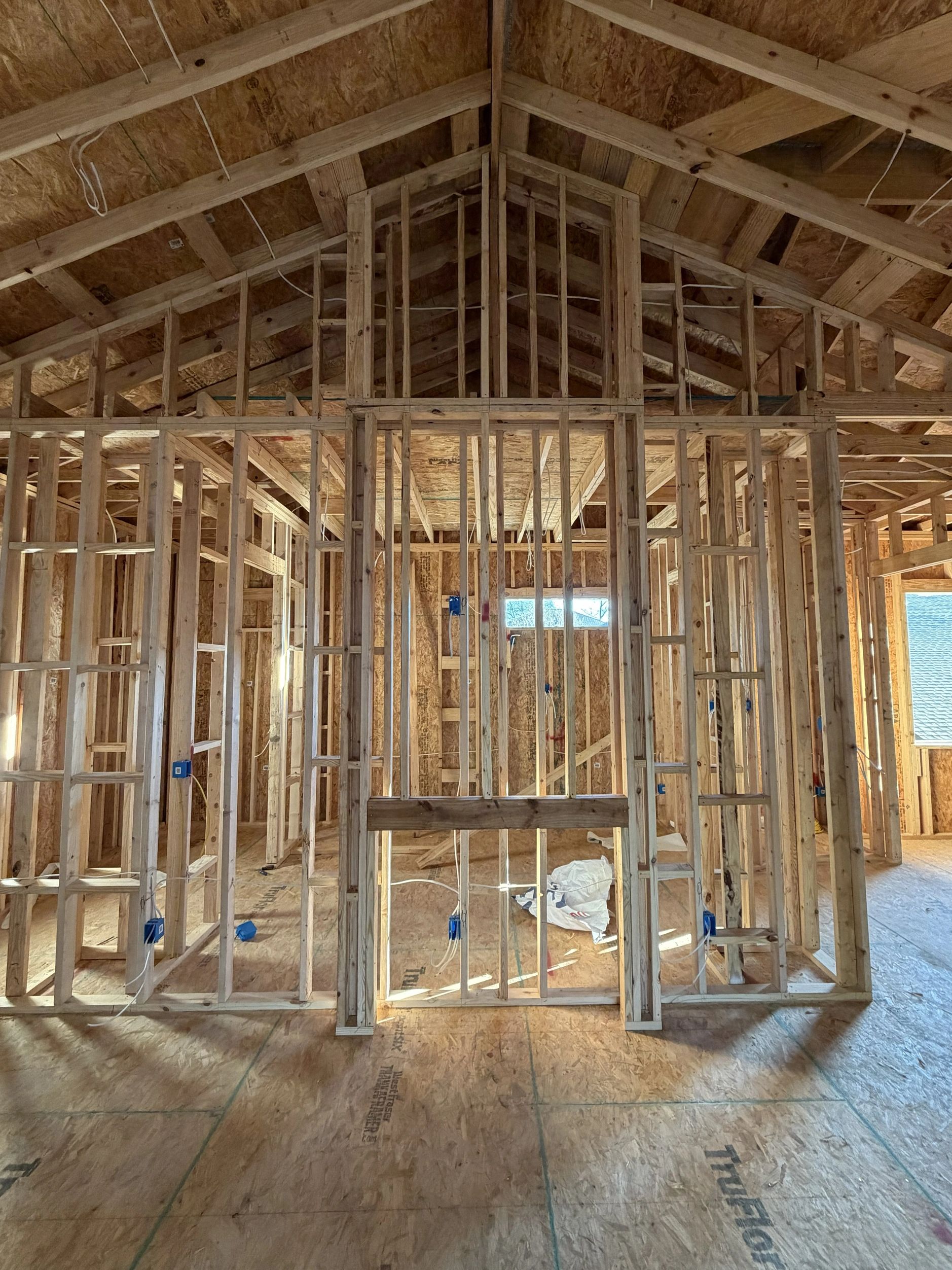Framing and wiring in a house under construction.