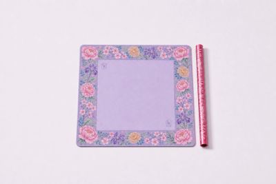 Square purple floral sticky notes pad with a matching pen.