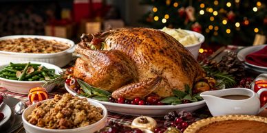 festive holiday turkey dinner with all the holiday side dishes with Christmas tree in background