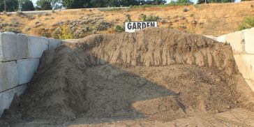 Heap of soil in a garden area.