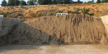 Large pile of sand at a storage site.