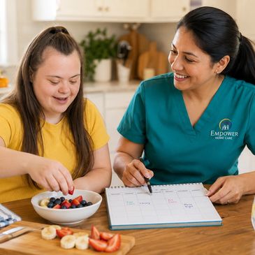 Caregiver and young woman enjoying healthy snack and planning day.