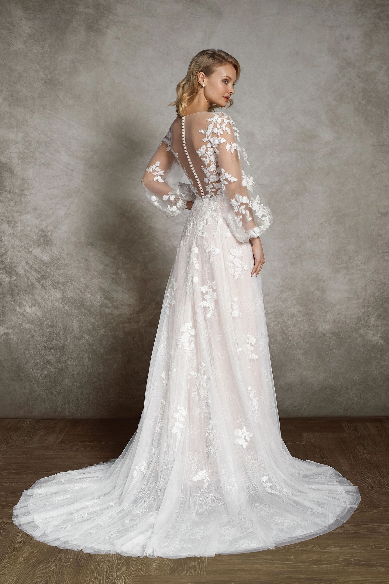 A romantic chiffon A-line wedding dress with long blouson sleeves